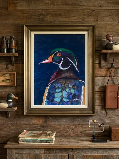 Drake Wood Duck by Jeff Miller, framed and hung on a wood-plank wall